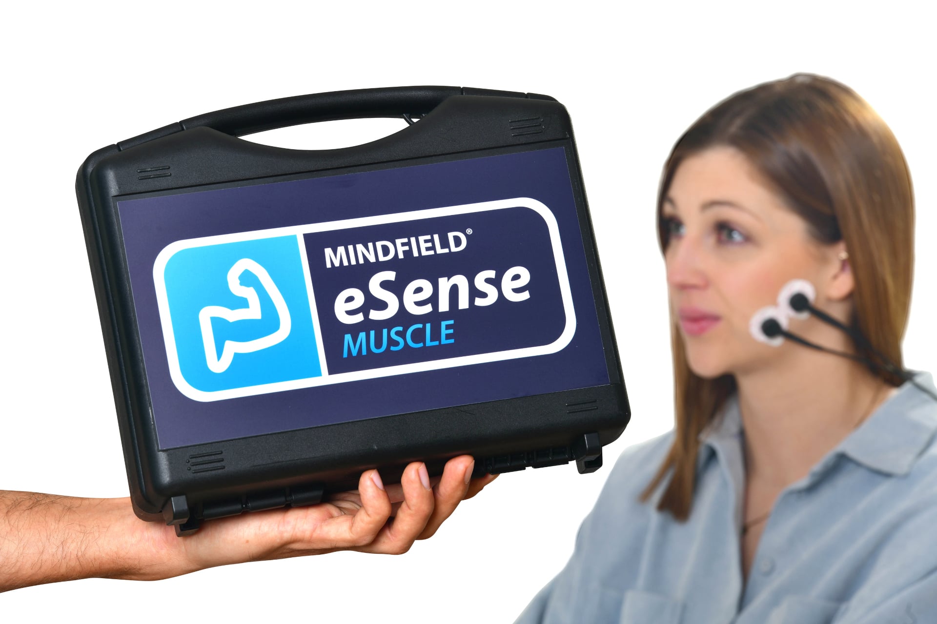 Hand holding the eSense Muscle carrying case; a woman wears the sensor near her jaw